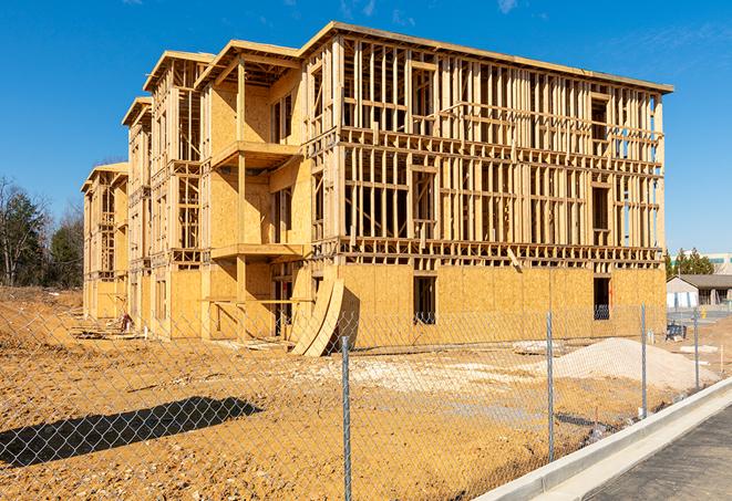 a job site enclosed by temporary chain link fences, ensuring safety for workers and pedestrians in Fort Mc Coy FL